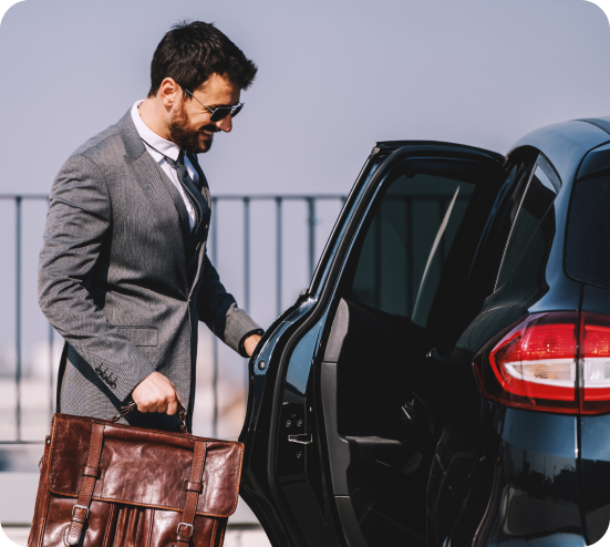 Person loading luggage into a car